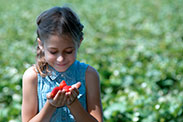 A girl with a strawberry